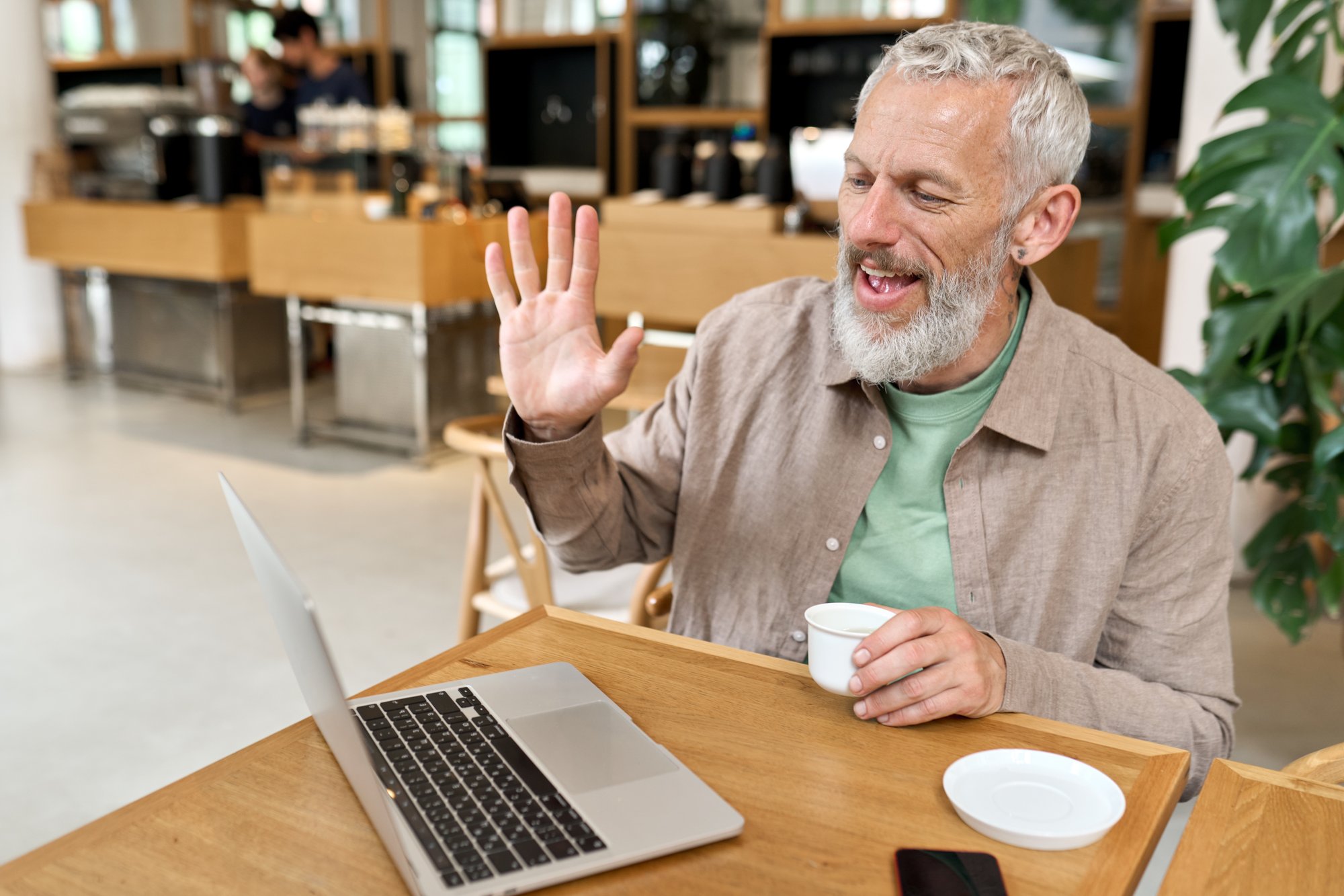 happy-older-business-man-using-laptop-computer-rem-2022-09-23-20-27-56-utc