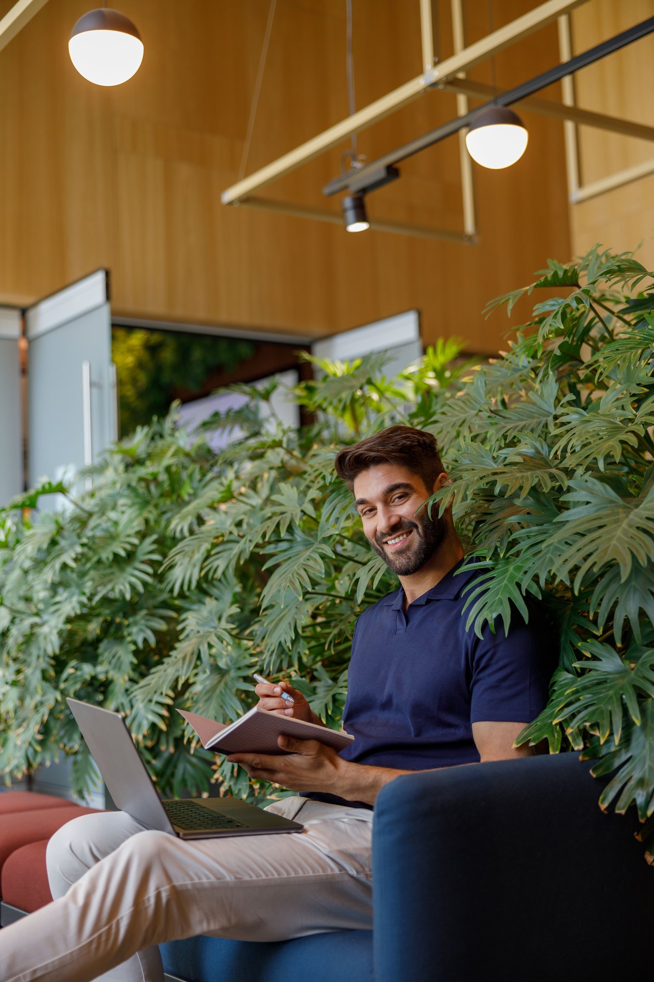smiling-handsome-freelancer-is-making-notes-during-2025-03-05-05-32-48-utc